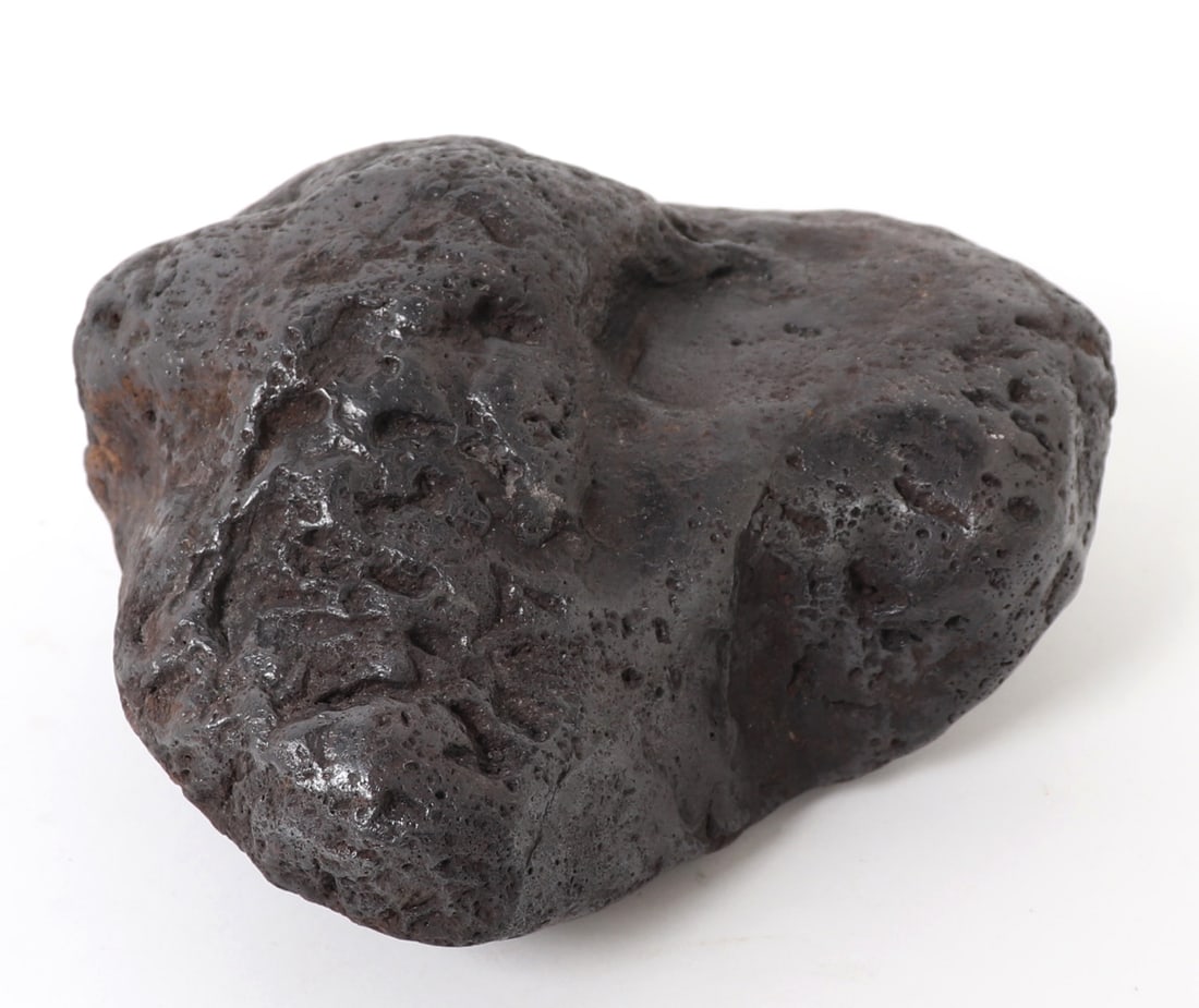 Large Raw Meteorite, 4,109 Grams: Souring through galaxies millions of years ago, this fantastic meteorite is one of a kind. Natural iron deposits shown throughout with incredible iridescence from burning through earths atmosphere. Si