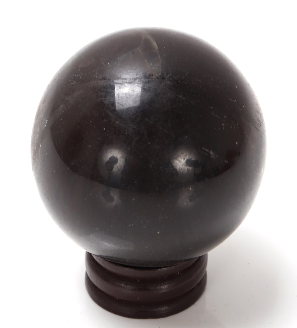 Wonderful Perfectly Polished Amber Sphere on Stand: Wonderful natural fossilized polished amber mineral specimen with a custom wood stand. Amber is derived from resin-bearing trees that once clustered in dense, now extinct forests. Size 2" H, weight 85