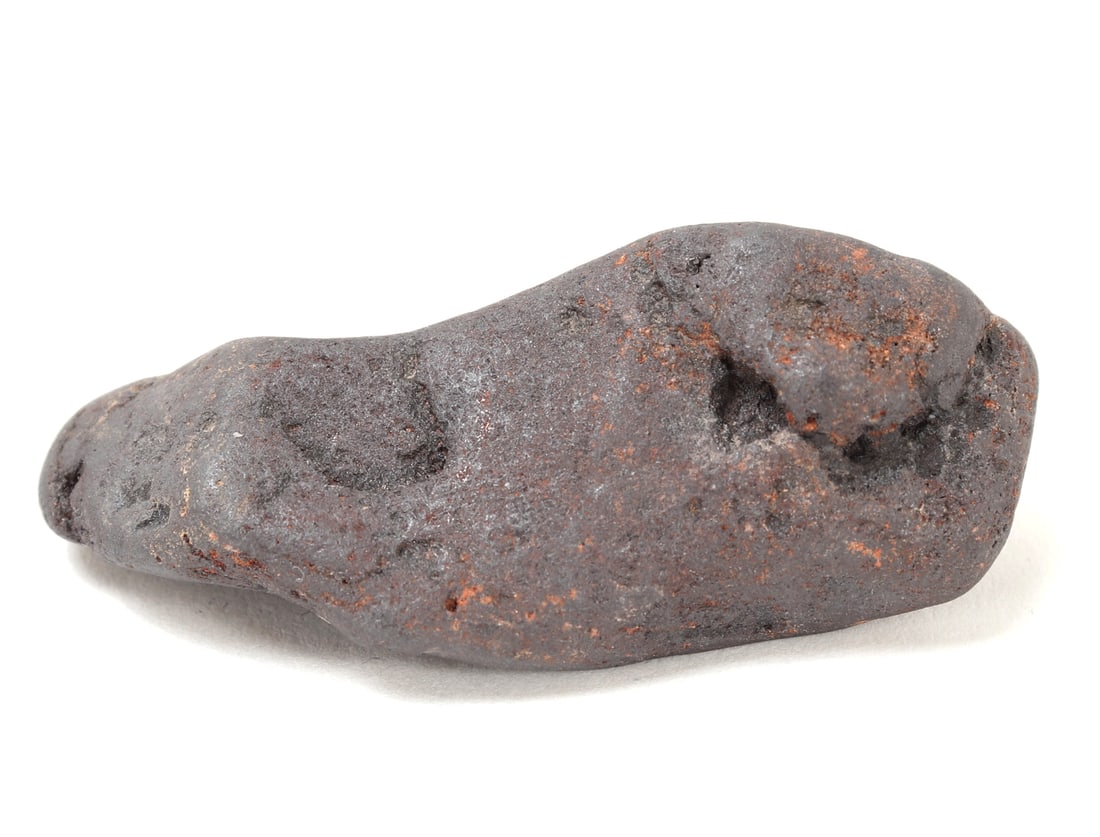 Fine Ancient Meteorite Specimen: Very nice small ancient meteorite mineral specimen with fine iron deposits throughout. Ancient losses throughout indicating this piece was natural larger originally before burning up in space. Size 2
