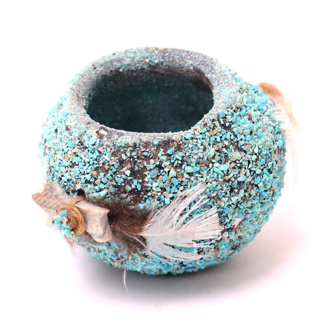 Native American Miniature Fetish Pot: Miniature hand made Native American fetish pot with applied turquoise throughout the body, and carved animals applied to either side with feather and turquoise details. Size 2" W x 1 1/4" H