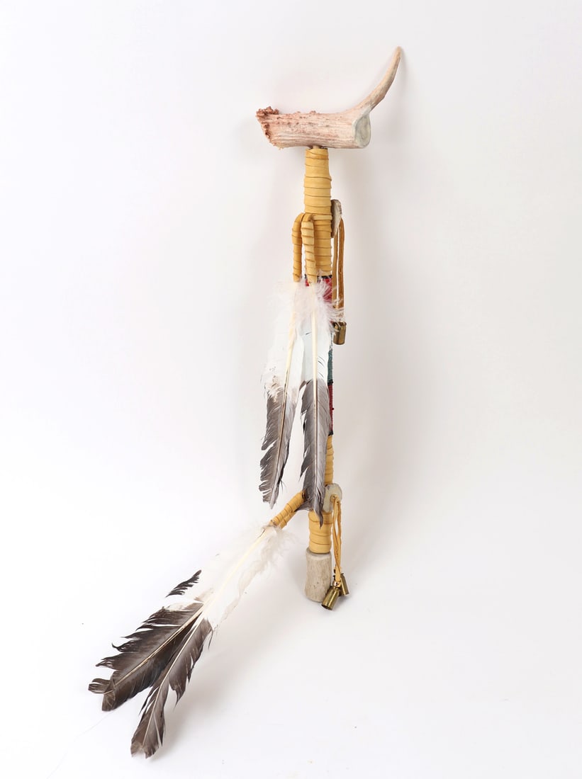 Zuni Shaman Antler Club: Nicely crafted Native American Zuni shaman club comprised of a strong wood shaft wrapped in leather with an antler fixed to one end. Feathers hang off the neck and base. Size 21" L, weight 370g