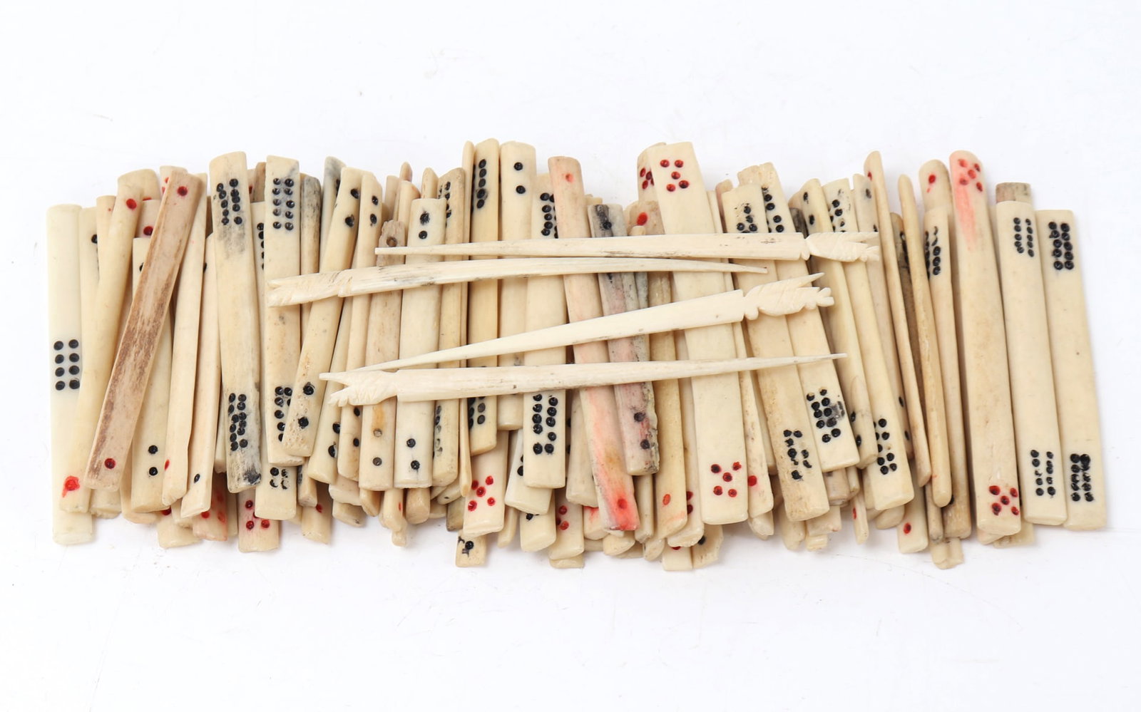 Bone Gaming Pieces: Hand carved and painted bone game pieces including a large set of bone dice and pegs. Size 2 1/2" L