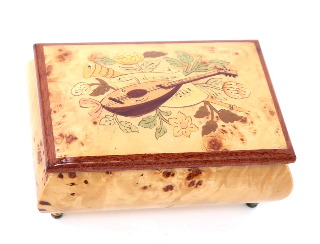 Lovely Hand Painted Jewelry Box, Isle of Capri: Italian, circa 21st century. Hand painted musical motif with multiple floral and foliage surrounding a guitar. Two compartment interior with red velvet. Music plays wonderfully strumming 'Isle of