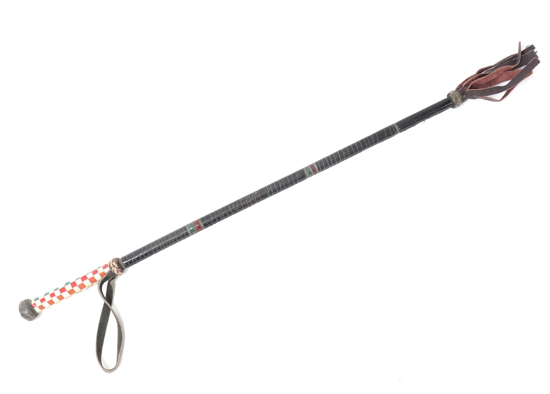 Gentleman's Horse Whip, circa 1920's: Nicely crafted 1920's gentleman's whip comprised of a wood shaft, tightly and expertly wrapped in leather. Checkered multicolored handle with yellow, red, orange and green. Size 27 3/4" L