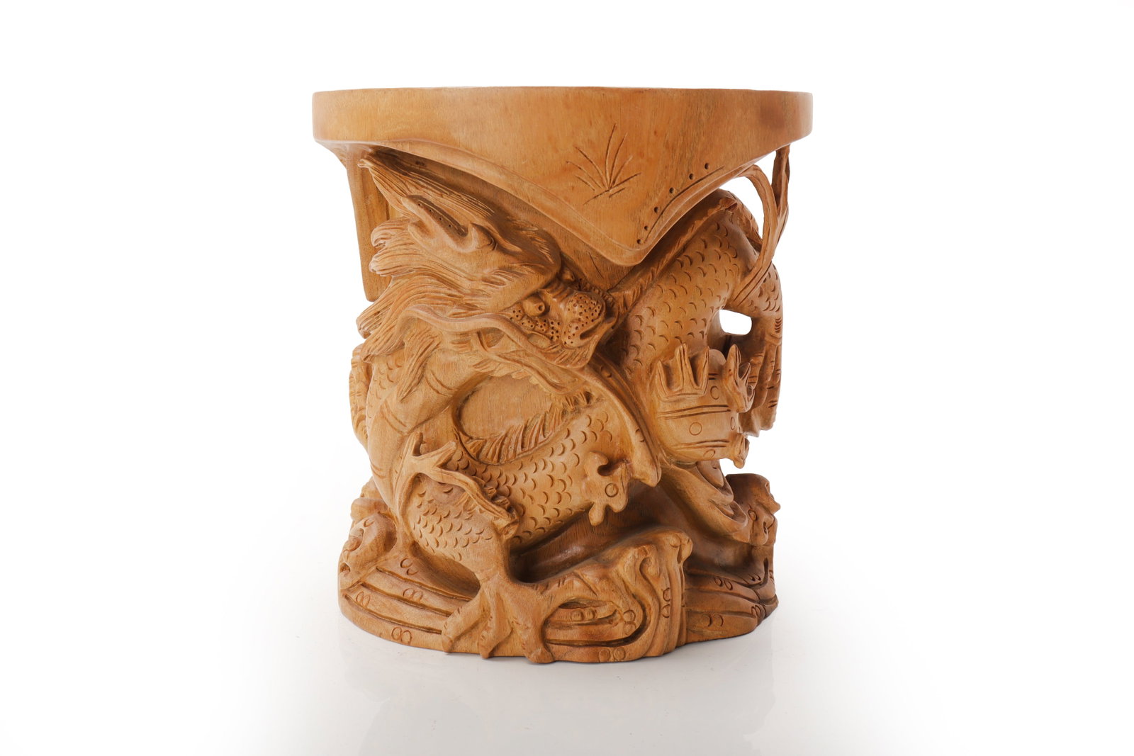 Carved Dragon Brush Pot, China 20th C.: China, 20th century. A carved wood brush pot of cylindrical form, worked in high relief featuring a dragon emerging among scrolling clouds and wave-like forms. The dragon is finely detailed with a