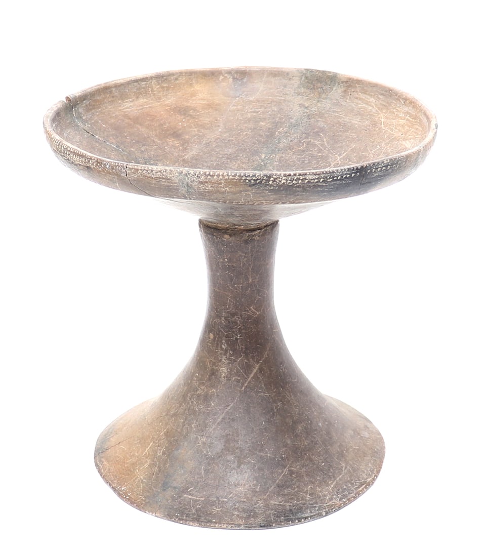 African Terracotta Pedestal Offering Bowl: Africa, probably West Africa, possibly ancient. Terracotta pedestal vessel of elegant flared form, with a broad circular foot rising to a narrow tapering stem and shallow open bowl. The exterior rim