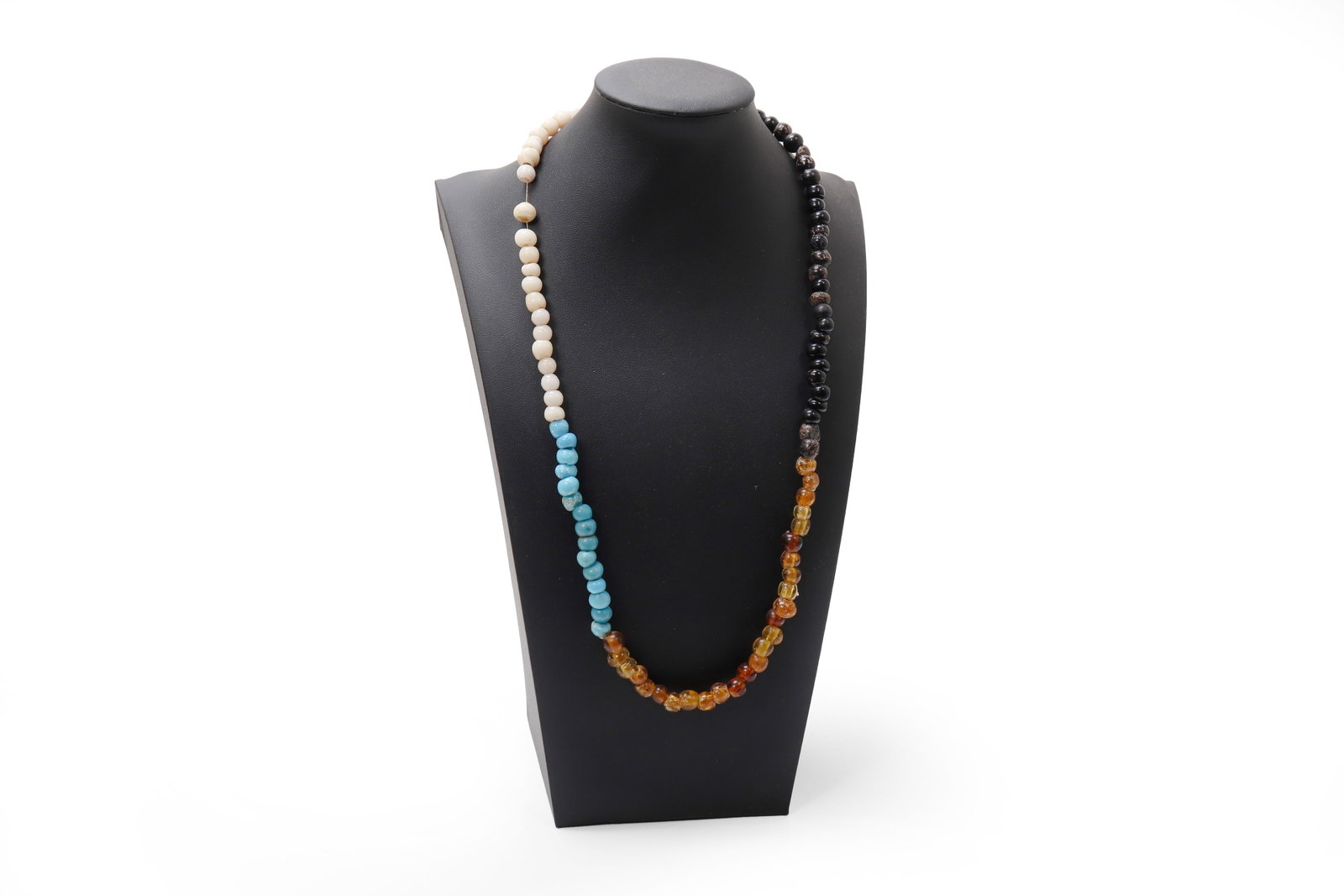 Mixed Hill Tribes Glass Bead Necklace: Asia, early 20th century Necklace composed of mixed Chinese glass trade beads traded in Thailand and Vietnam - beads in contrasting sections of pale cream, bright blue, dark brown-black, and warm ambe