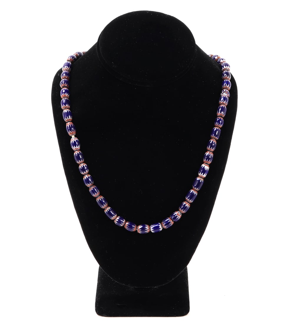 Gorgeous Handcrafted African Trade Bead Necklace: Wonderful set of uniquely detailed hand crafted African trade bead necklace. Bright blue, red and white highlighted details throughout each bead. Size necklace 24" L Family collection of an esteemed d