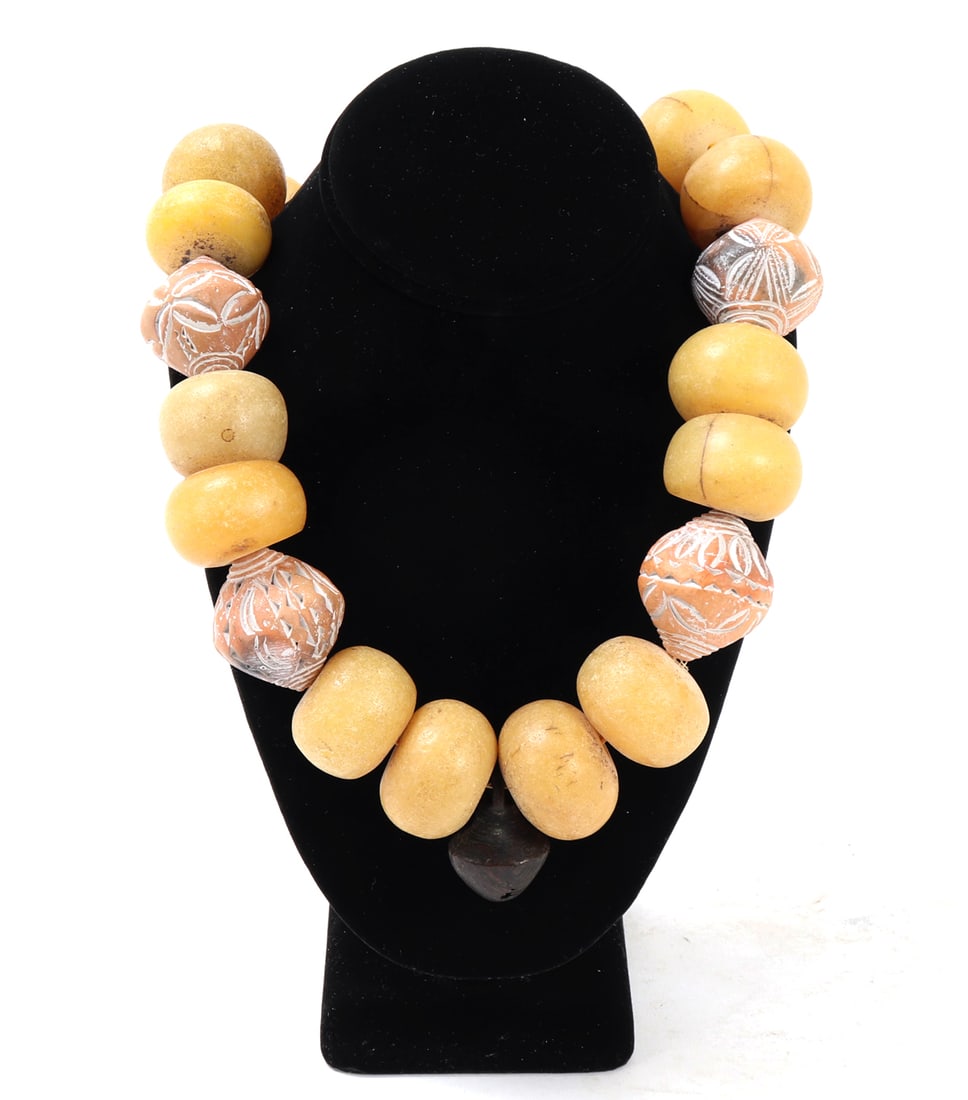 Bright Bold African Statement Necklace, Handcrafted Beads: Beautiful heavy bold African trade bead necklace in lovely bright yellow and orange coloring, lovely metal bell pendant to the center. Size 22" L, bell pendant 1 3/8" L Family collection of an