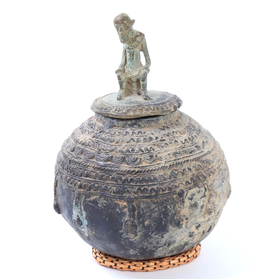 African Bronze Lidded Vessel with Figure: Dogon Ceremonial Bronze Lidded Pot, Mali. Ornamented with traditional Dogon iconography, this bowl is used by tribal elders to store their fetish materials and personal possessions. The Dogon make