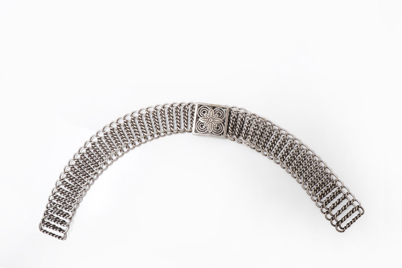 Vintage Indian Silver Belt: India, 20th century A finely worked Indian silver belt of elegant and highly wearable form, constructed in a supple mesh-like arrangement of closely interwoven links that creates a rich braided