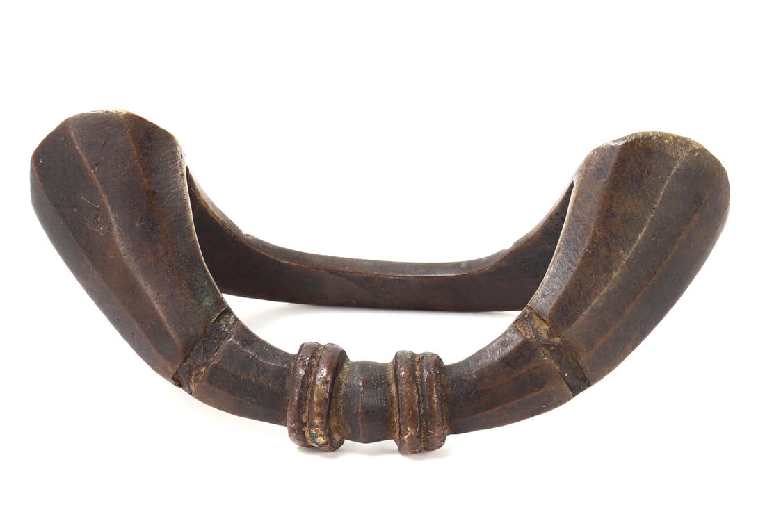African Bronze Coin Ankle Bracelet, Senoufo: This African Bronze Coin Ankle Bracelet originates from the Senoufo people, circa late 19th - early 20th century. Crafted with intricate design, it reflects both utilitarian and ceremonial use, often