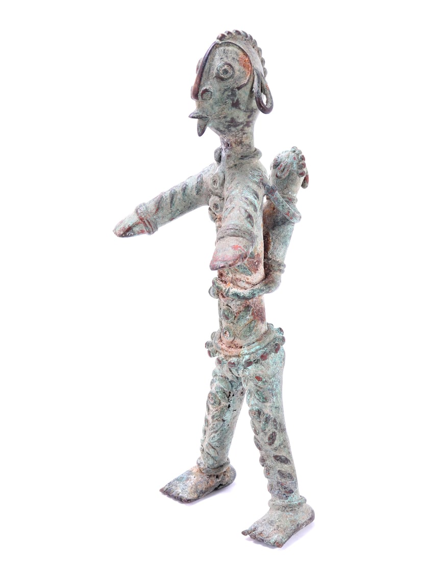 Large Yoruba-Style Bronze Mother and Child Sculpture: West Africa, Nigeria, Yoruba peoples or Yoruba style, 20th century. Cast bronze figural sculpture depicting a seated mother holding a child, the mother adorned with elaborate body ornamentation and