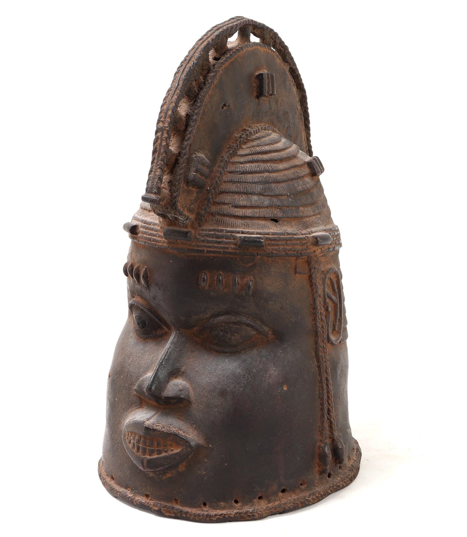 Benin Bronze Oduduwa Mask: African Benin bronze style Female masquerader head, 20th century. Cast in the lost wax technique in bronze with a large opening to the underside and a series of square punch perforated holes around
