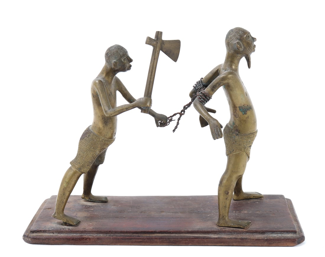 Benin Brass Execution Scene: This Benin Brass Execution Scene is a captivating depiction of historical significance, expertly crafted by artisans from the Kingdom of Benin. The sculpture features two figures, with intricate