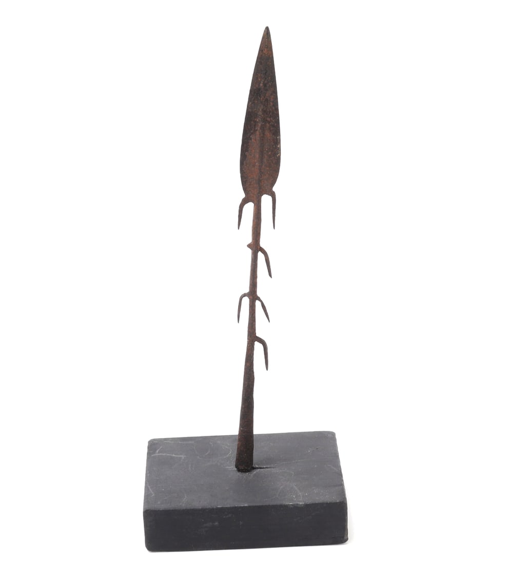 Central African Barbed Spear, Circa 1800s: Central Africa, Democratic Republic of the Congo (DRC), Probably Kuba culture African Barbed Spear, circa 1800s. This distinctive weapon features a leaf-shaped iron blade with pronounced barbs,