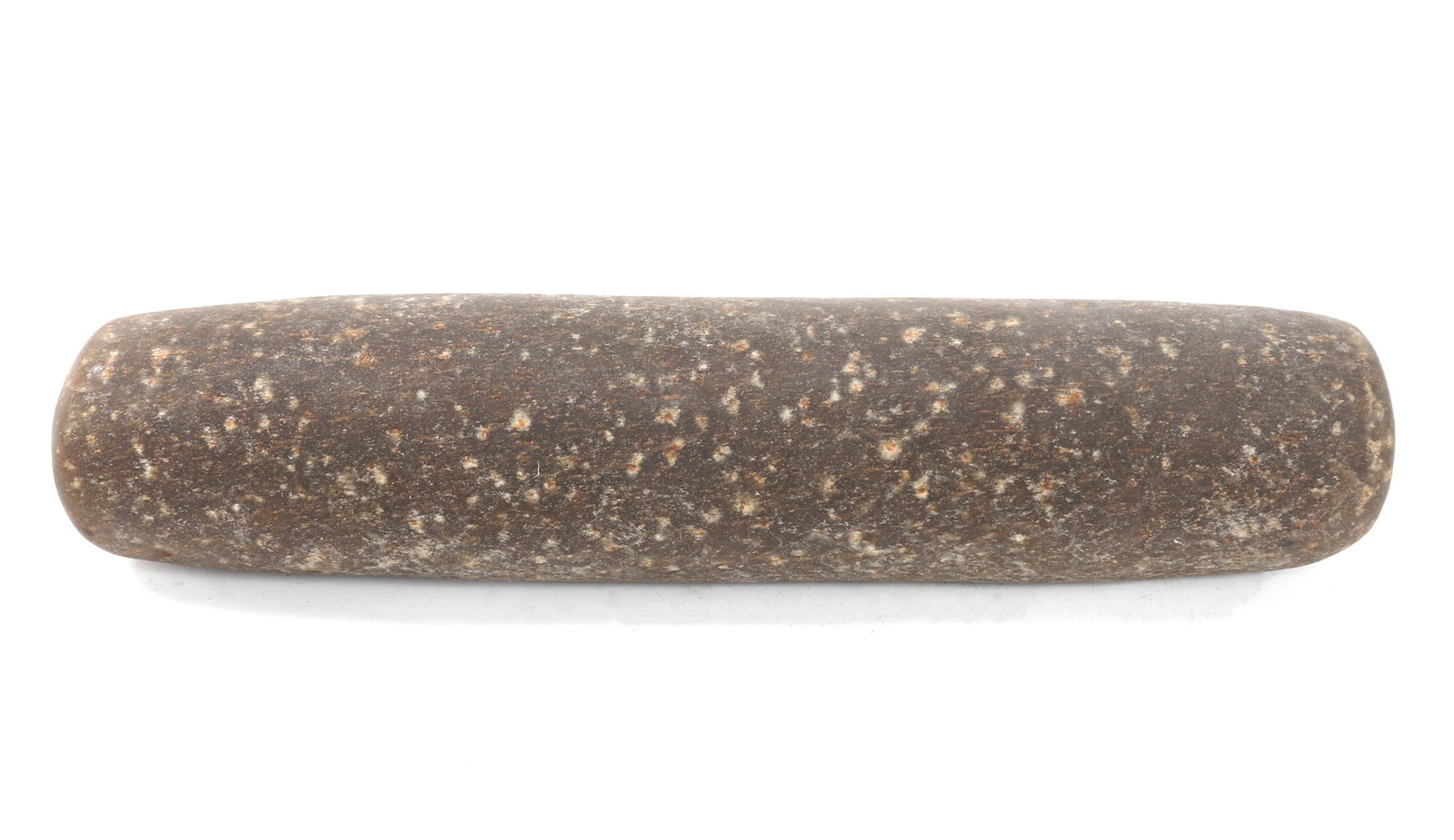 Large African Stone Pestle: Large African stone carved pestle in grey stone with white speckled flakes. Lightly tined to one side with a brown pigment from use. Size 14" L, Weight 9 lb. 1.2 oz Ex-Tennessee Estate. Family
