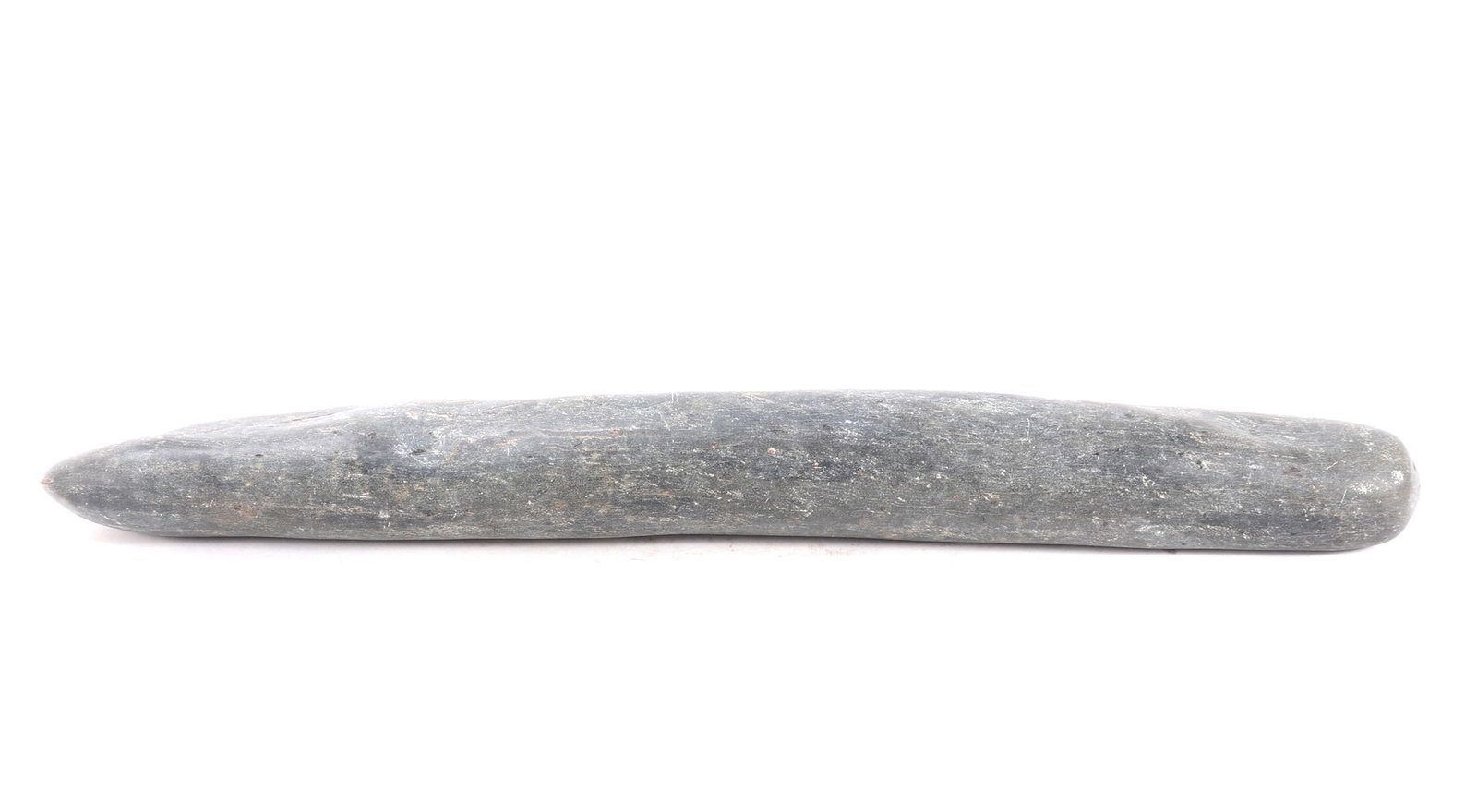 Large Neolithic Grinding Stone, Africa: An impressive and very large Neolithic grinding stone, expertly carved from a dense, dark grey hardstone with distinctive white speckling. Likely used for processing grain, the stone features a
