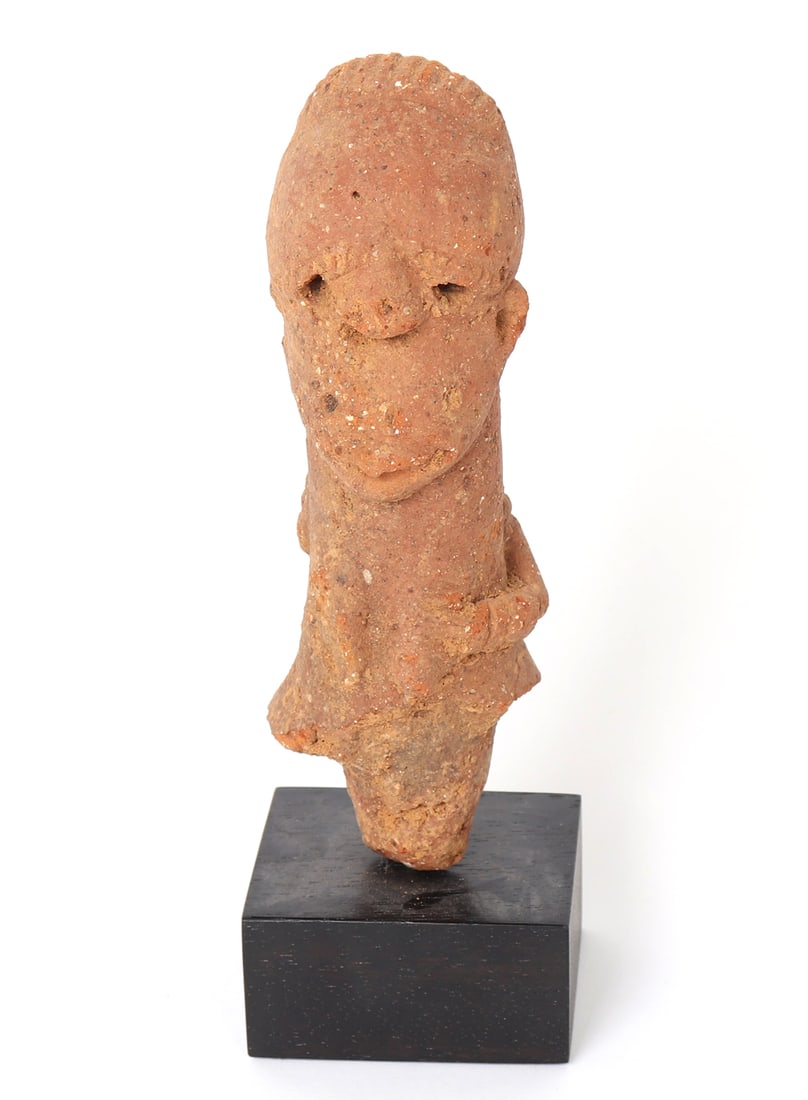 Ancient West African Terracotta Figural Fragment, 500BCE - 1000CE: Nigeria or Niger Region, possibly Nok, Bura, or related tradition, circa 500 BCE-1000 CE. Hand-modeled terracotta figural fragment, possibly representing a head or upper torso, mounted on a later cust