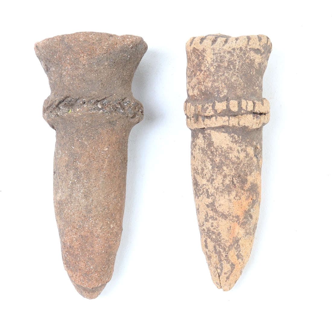 Two Koma Terracotta Abstract Figures: West Africa, Ghana/Burkina Faso region, Koma culture, circa 12th - 16th century. A group of two small terracotta abstract head or figure forms, each of tapering pointed construction with raised