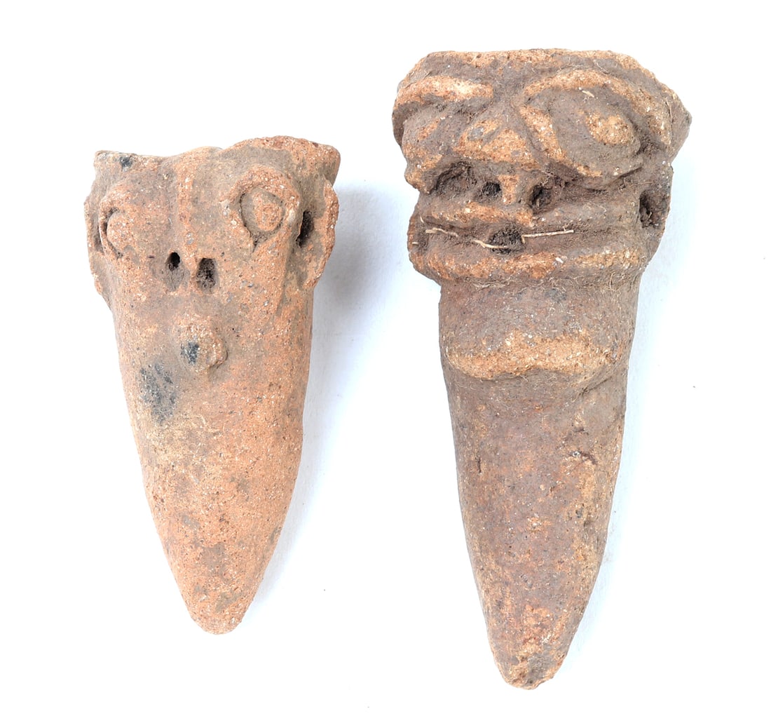 Ancient Koma Terracotta Heads, 12th - 16th C.: West Africa, North Ghana, Koma peoples 12th - 16th century. Pointed terracotta heads with elongated features and wide open eyes in the characteristic Koma fashion. Size 4" L, Weight 145 g Ex-USA