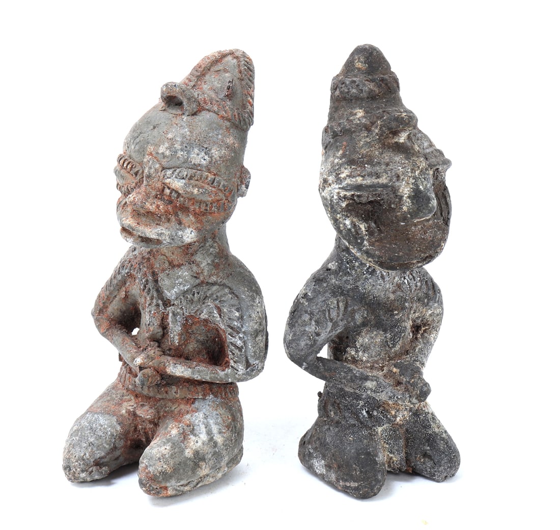 Pair of Onile Figures, Yoruba: Pair of Onile Figures, Yoruba. This captivating duo of terracotta statues. Each figure, standing at just over 4 inches tall, each depicts a kneeling figure, adorned with detailed facial features and