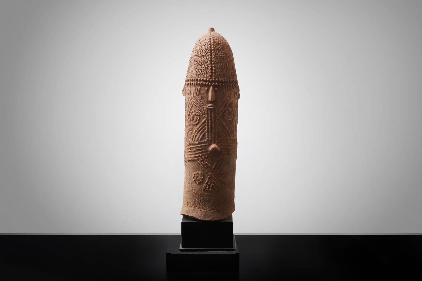 Bura Funerary Phallic Amphora, Niger River Valley: West Africa, Niger River Valley region, Bura / Bura-Asinda-Sikka culture, circa 3rd?11th century CE. Terracotta funerary vessel of elongated phallomorphic form, with a domed terminal above a