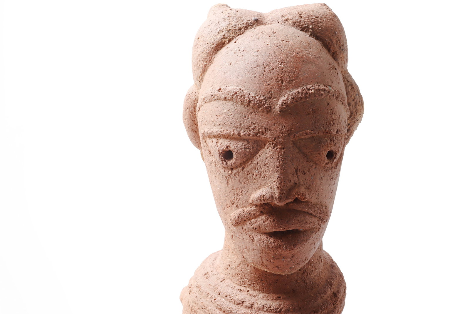 Massive Nok-Style Terracotta Figure: West Africa, Nigeria, in the style of the Nok culture, possibly Iron Age tradition, circa 500 BCE-200 CE or later. A substantial hand-built terracotta figure modeled in an elongated reclining or recum