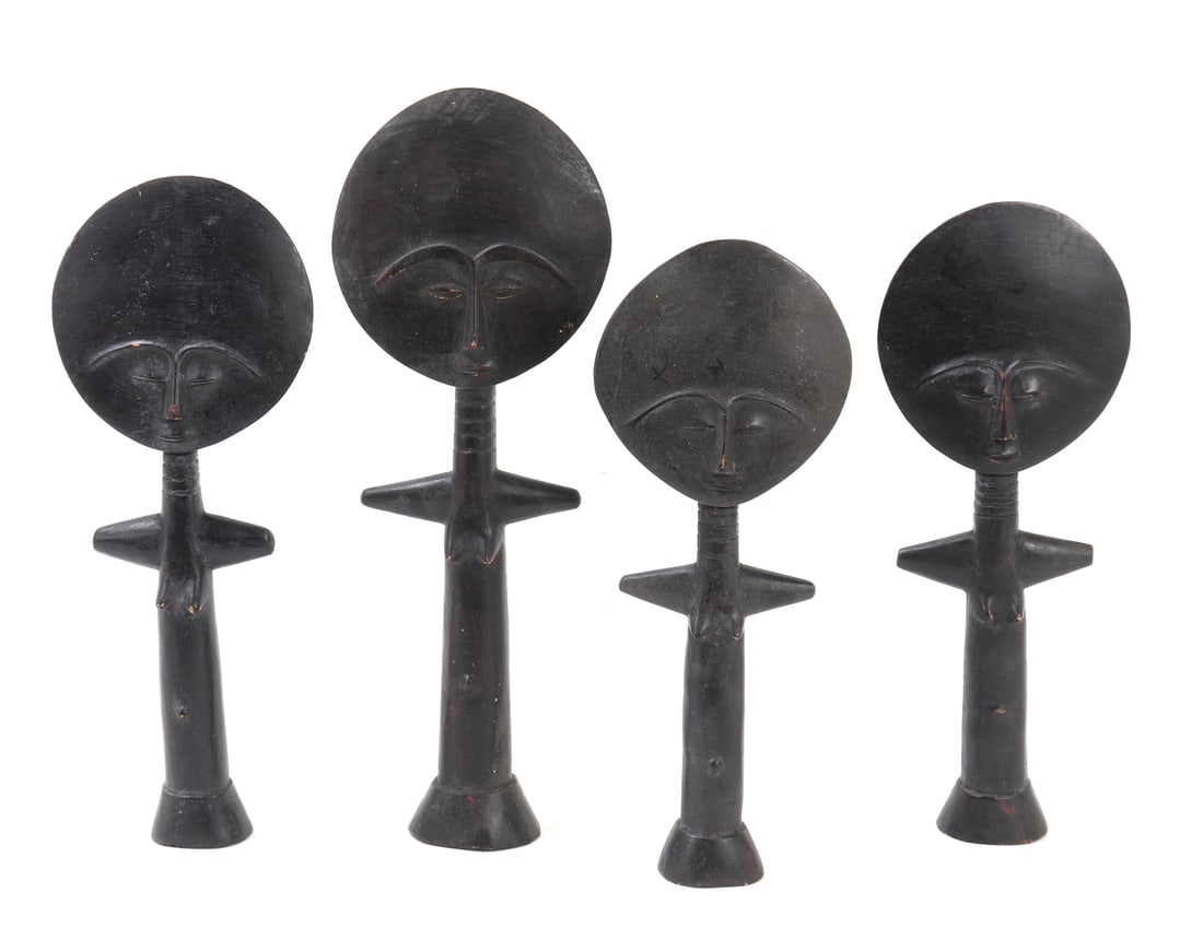 Group Lot of Four African Fertility Dolls: Ashanti, African wood carved fertility dolls. Each carved in classic form with moon shaped head, each incised with vertical and diagonal lines throughout the reverse of each doll. These dolls were wor