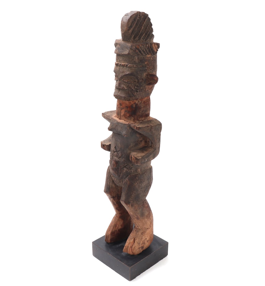 African Wood Carved Female Statue on Stand: Nice African wood carved female figure. She's depicted standing nude with arms at her sides, palms facing up like she has an offering. Tall braided coiffure with incised details throughout. Scarring