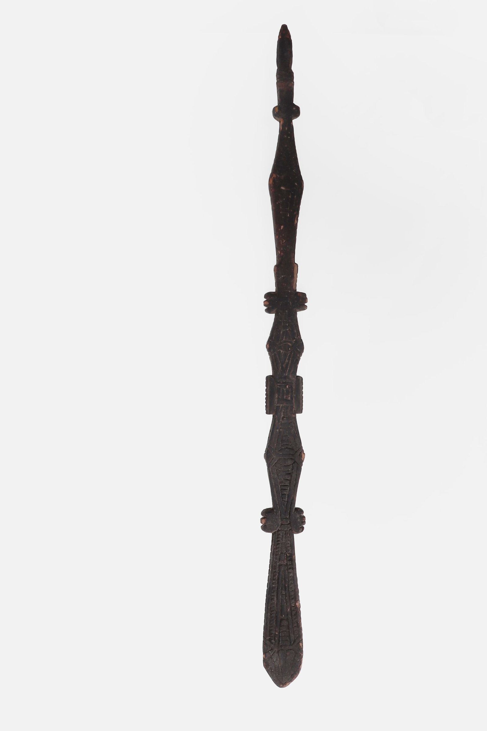 Congolese Chieftain's Prestige Wand: Central Africa, Democratic Republic of the Congo, 20th century. Carved wooden prestige wand or chiefly staff, the elongated form with a dark patinated surface and finely incised geometric ornament.