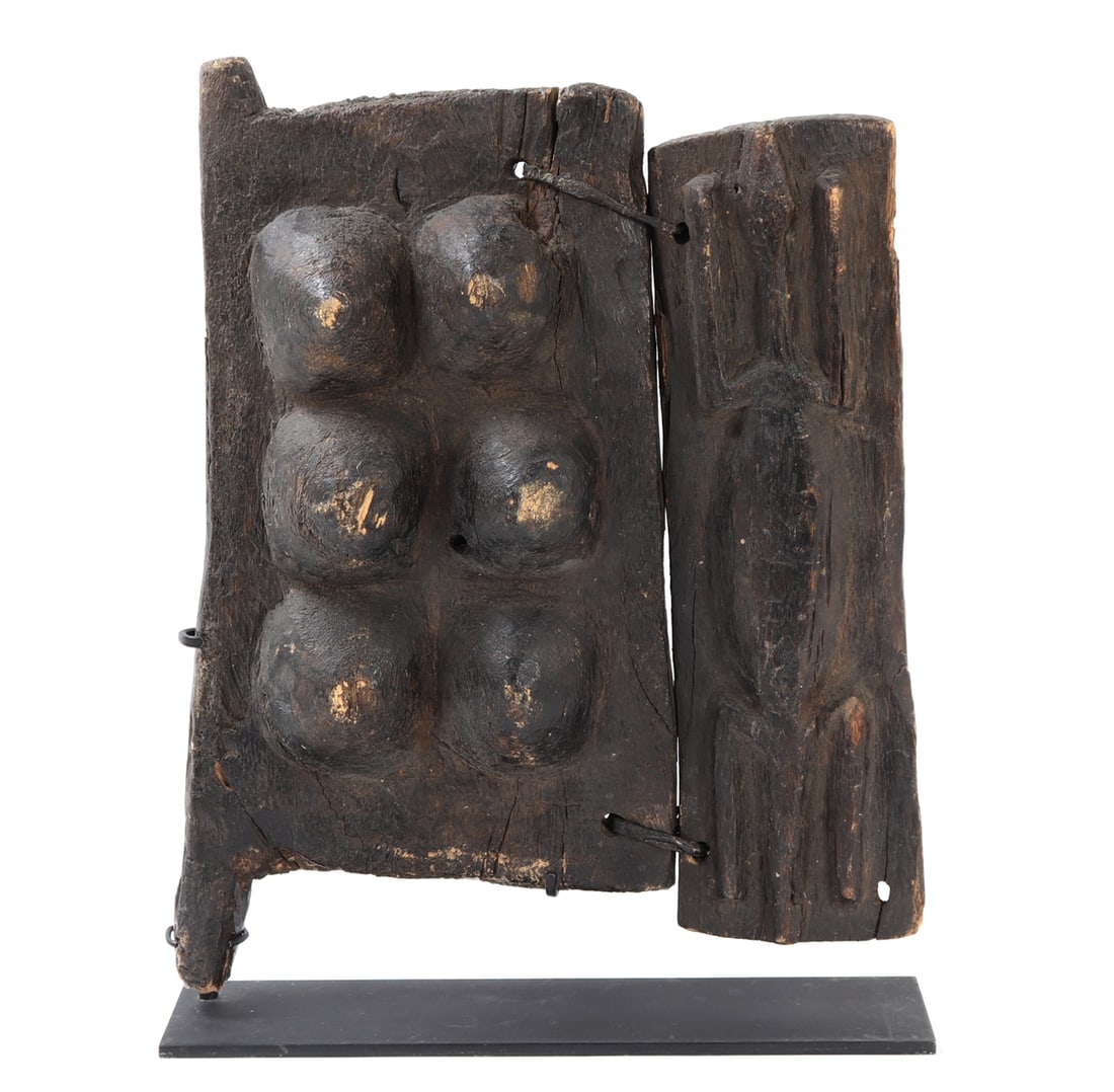 Figural Panel Door or Shutter, Dogon Culture: Mali, Dogon Culture 20th Century A carved wooden panel, likely from a granary door or architectural shutter, rendered in dark hardwood with a richly aged surface. The composition is divided into two