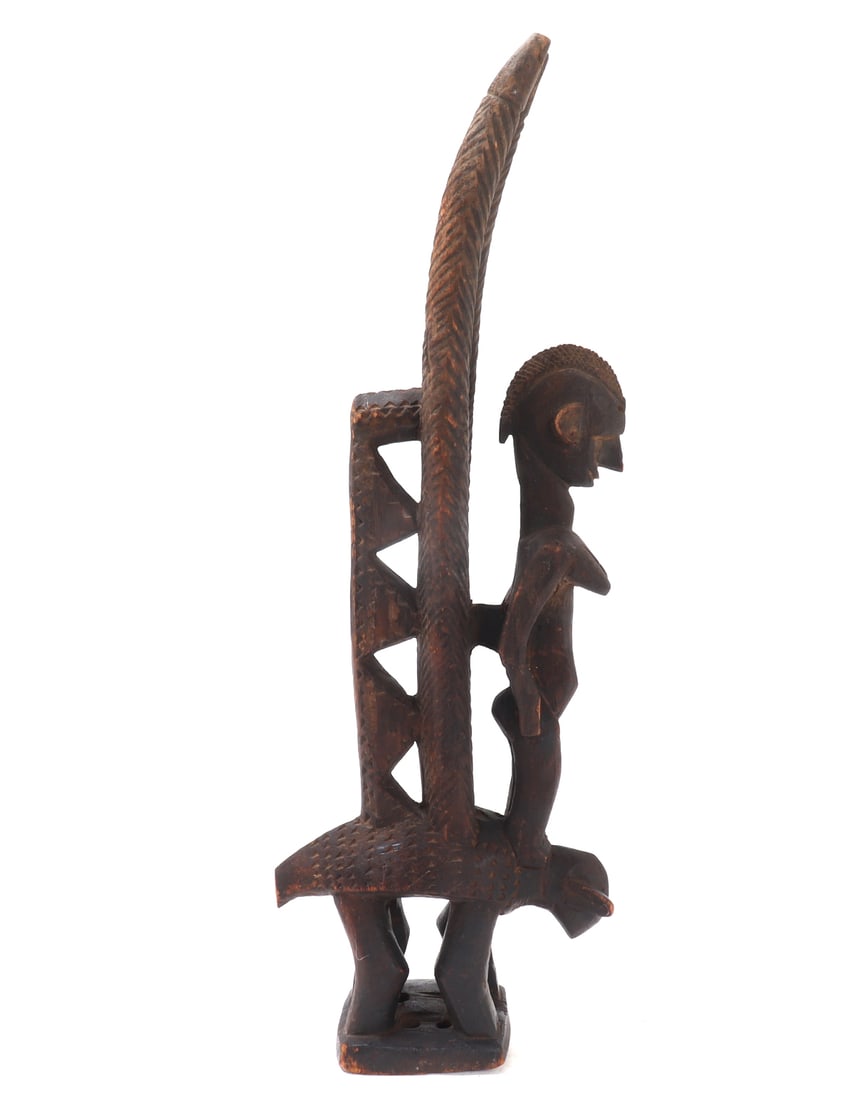 Bamana Chiwara Headdress, Mali: Nice African wood carved Chiwara headdress, with a human female figure standing on a animals shoulders. Used in rituals associated with agriculture, particularly in ceremonies that celebrate the mythi