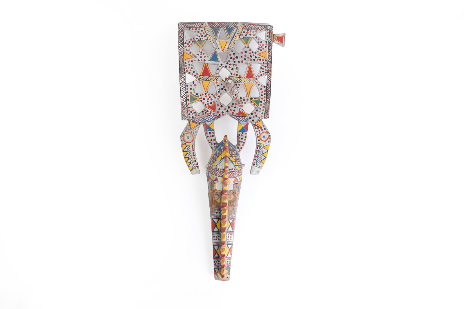 Bobo Polychrome Antelope Mask: West Africa, Burkina Faso or Mali, Bobo peoples. A large carved wood mask or headdress of elongated form, with a projecting tapering face and openwork superstructure. The upper panel is carved with a