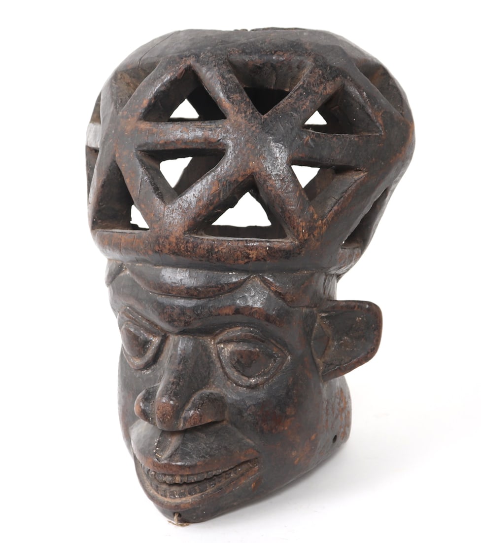Authentic Bamum Helmet Mask, Cameroon Grasslands: Cameroon, Grasslands Kingdoms, the Bamum Kingdom. Bamum peoples helmet mask carved in wood with openwork head. Independently reviewed by a member of the Ethnic Arts Council and believed to be