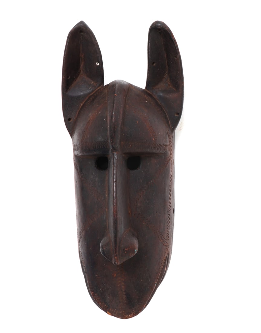 African Wood Carved Lion Mask: Nicely carved African lion mask, likely Bamana culture based on the classic shape and style. Incised geometric designs around the face and mouth. Protruding nose with tall pointed ears and mouth