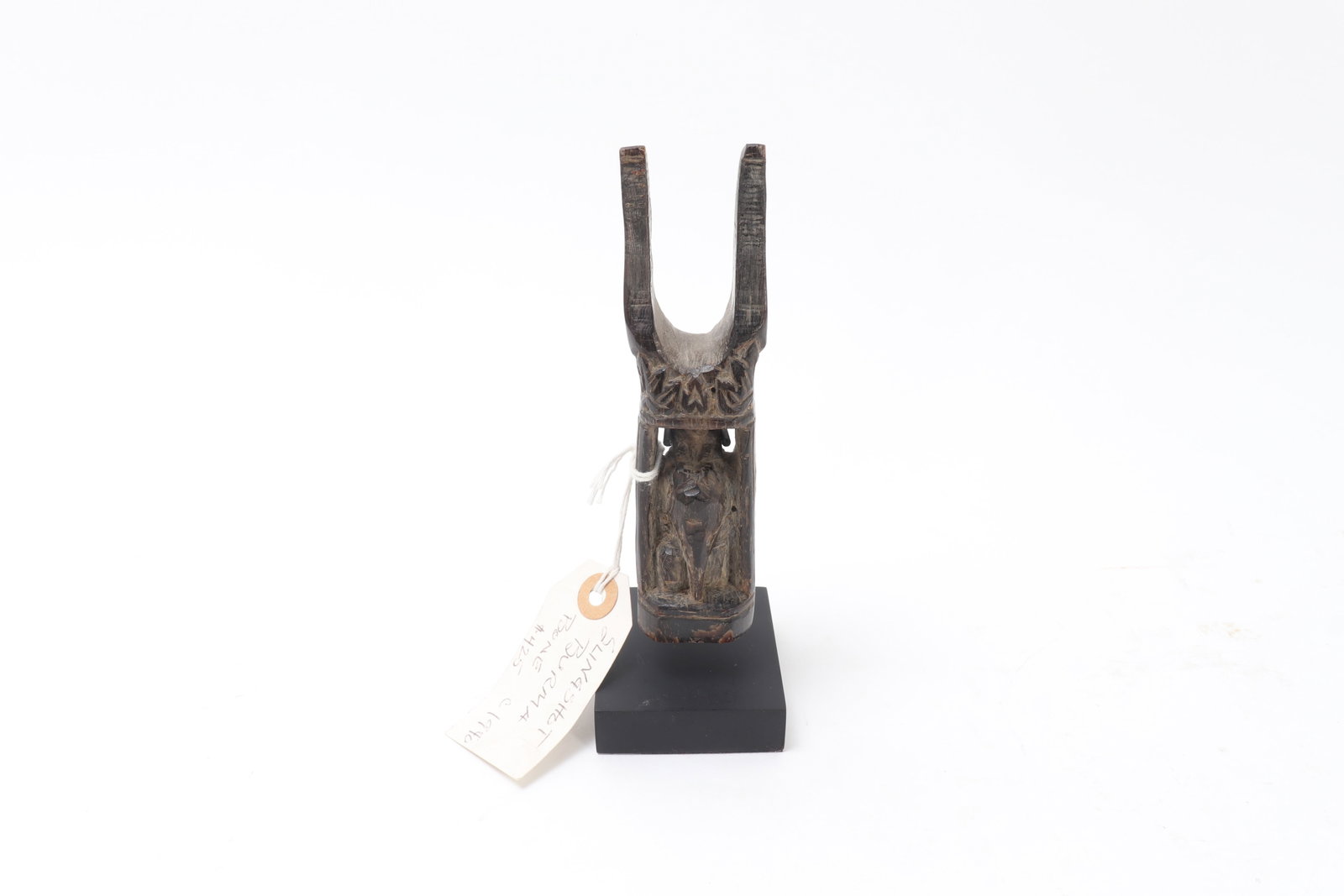Burmese Water Buffalo Horn Slingshot: Burma (Myanmar), probably 19th century or later A carved water buffalo horn slingshot of upright tapering form, the body finely worked with incised scrolling ornament and centered by a recessed