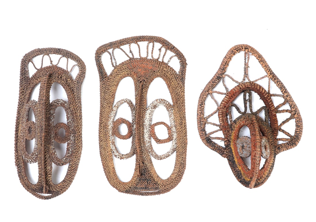 Group of Three Fiber Yam Masks: Nice group of three hand crafted yam masks comprised of fiber and bamboo, each intricately detailed. Braided and shaped into avian style masks, each decorated in a different colored pigment including