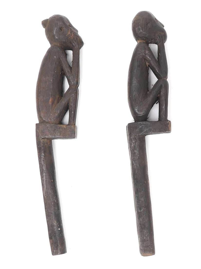 Pair of Wood Carved Shaman Box Charms, Iban Dayak: Iban Dayak, Sarawak State, Borneo Island, Malaysia. Pair of wood carved seated figures. Each depicted with arms resting on bent knees, chin resting in hands. One has a bun style finial. These would
