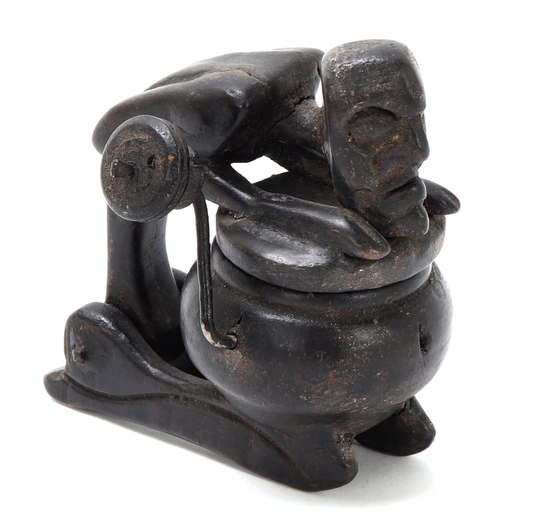 Lambak Figural Chalkline: Indonesia, Sumatra or Borneo region, Lambak or related people, carved wood chalkline or marking tool, the container formed as a rounded vessel raised on small feet, with a hinged figural cover