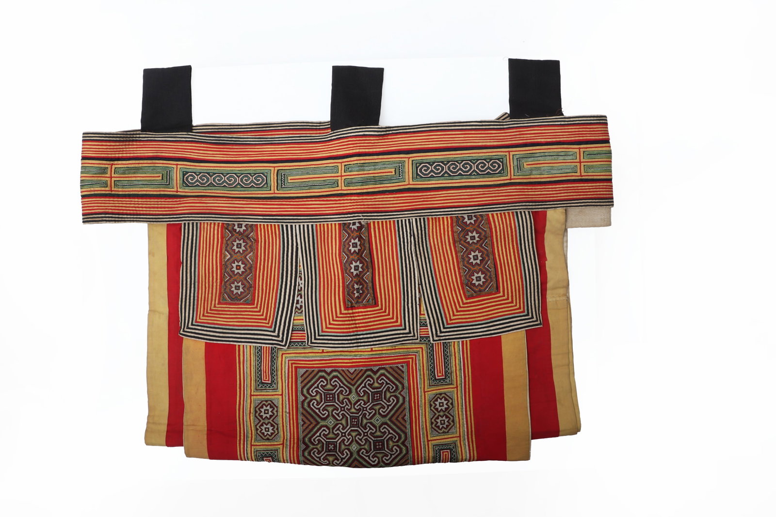 Rare Hand-Embroidered Miao Chinese Baby Carrier: China, probably Miao or related minority tradition, 20th century or earlier. This rare antique Chinese baby carrier is a beautiful example of traditional textile craftsmanship and practical design.
