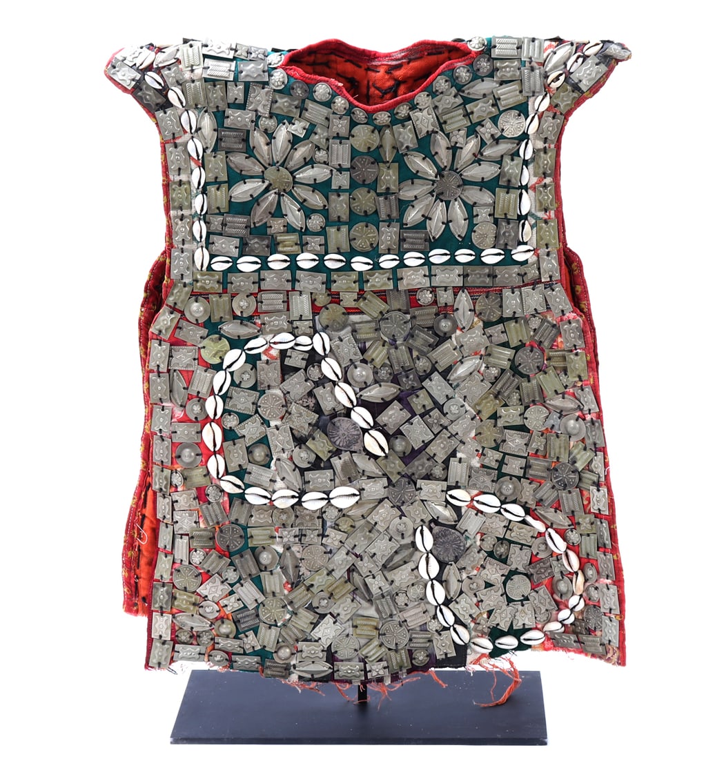 Tomud Turkmen Child Tunic Collectible: Decorated Vest Turkmenistan People Afghanistan used for the circumcision ceremony. Decorated with Cowrie Shells. Size 16" W x 20" H, 22 3/4" H on included custom stand.