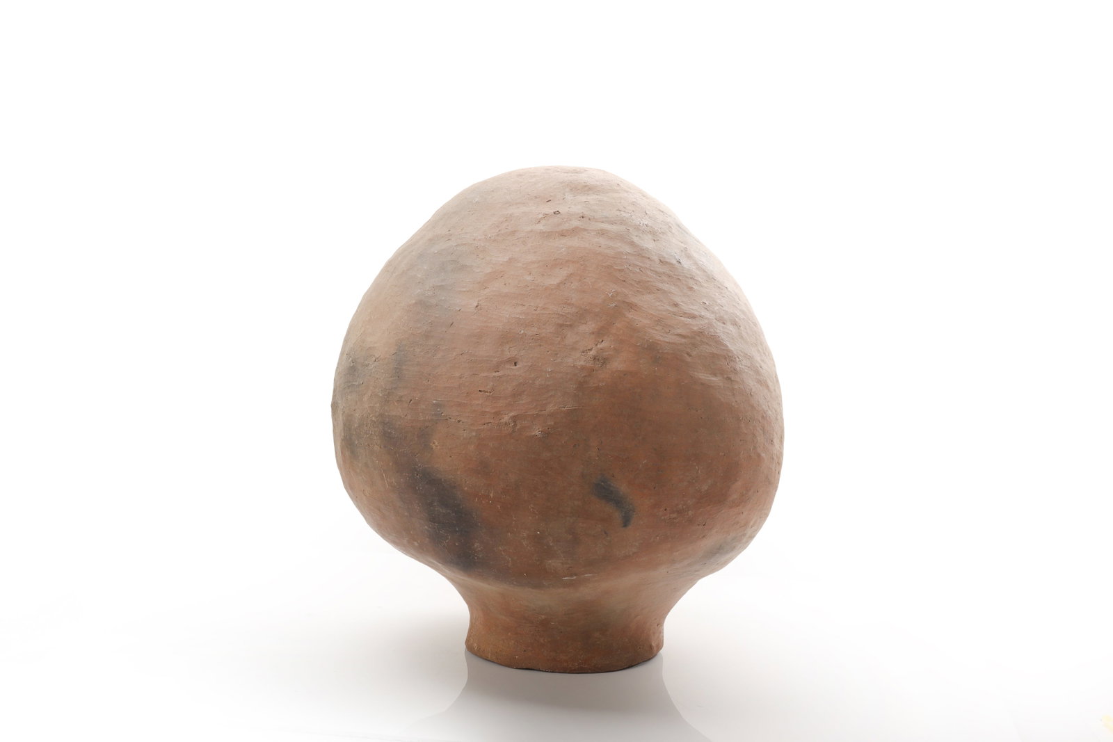 Pre-Columbian Olla Vessel, ca. 250 BCE- 250 CE: Pre-Columbian, West Mexico, Colima, ca. 250 BCE?250 CE. The vessel is formed in a warm reddish-tan clay with scattered dark gray to black fire-cloud markings across the surface, characteristic of