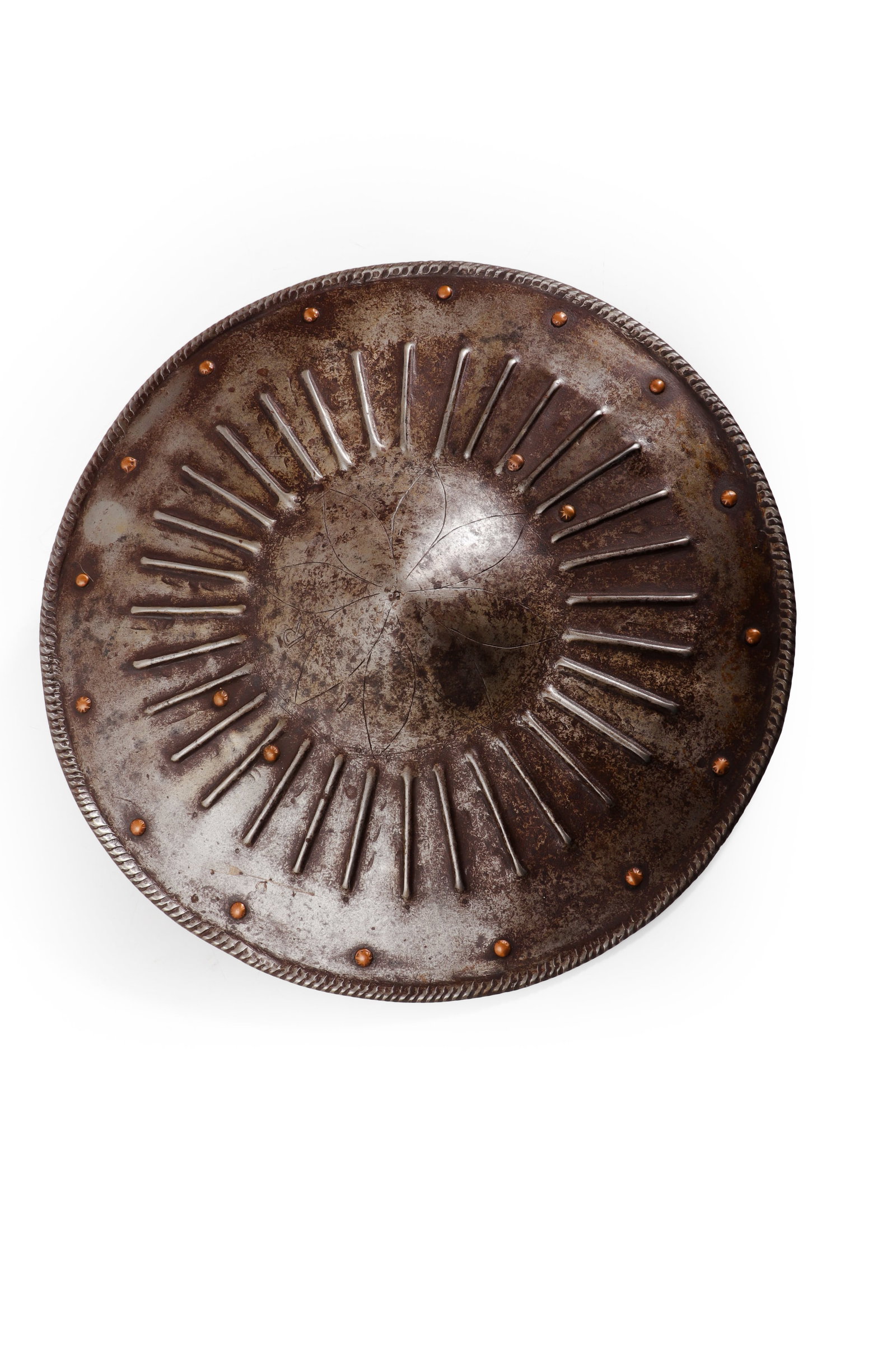 European Buckler Shield, 16th C. Style: Victorian, 16th century style, likely composed in the 19th century. Circular iron buckler shield of shallow convex form with radiating repouss? ribs surrounding a central boss. The perimeter is