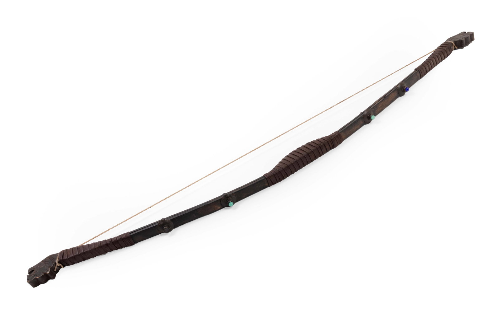 Modern Decorative Recurve Style Bow: Modern decorative bow with a dark stained wood, wrapped grip sections, carved end terminals, and a simple cord string. The bow is embellished with small inset colored cabochons, including turquoise