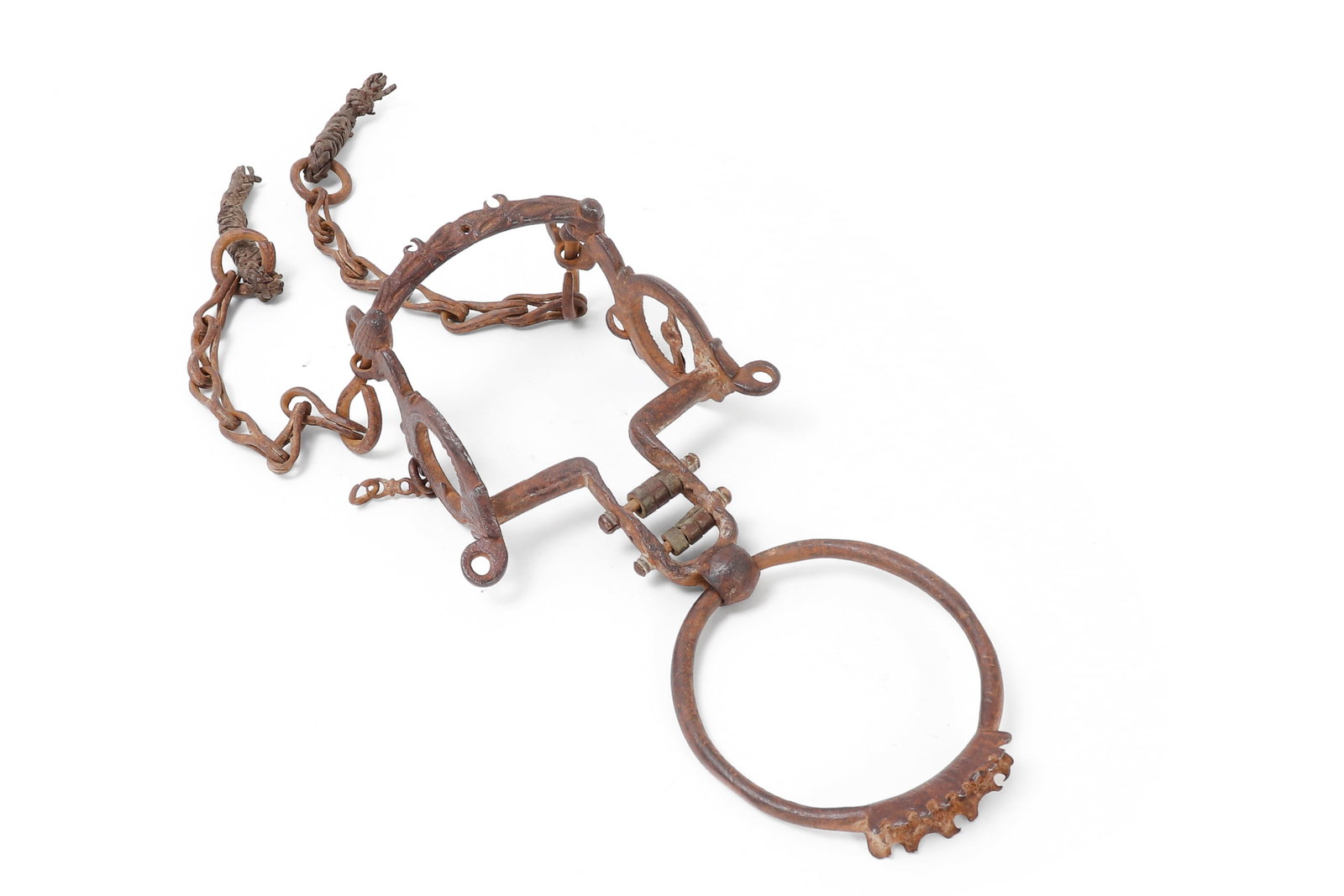 Antique Mexican Spanish Colonial Forged Iron Ring Bit (Freno de Argolla) with Chain Lip Straps: An antique Mexican / Spanish Colonial horse bit of traditional ring bit form known as a freno de argolla, meaning bit with ring, 19th to 20th century. Hand forged from heavy iron, the piece has two