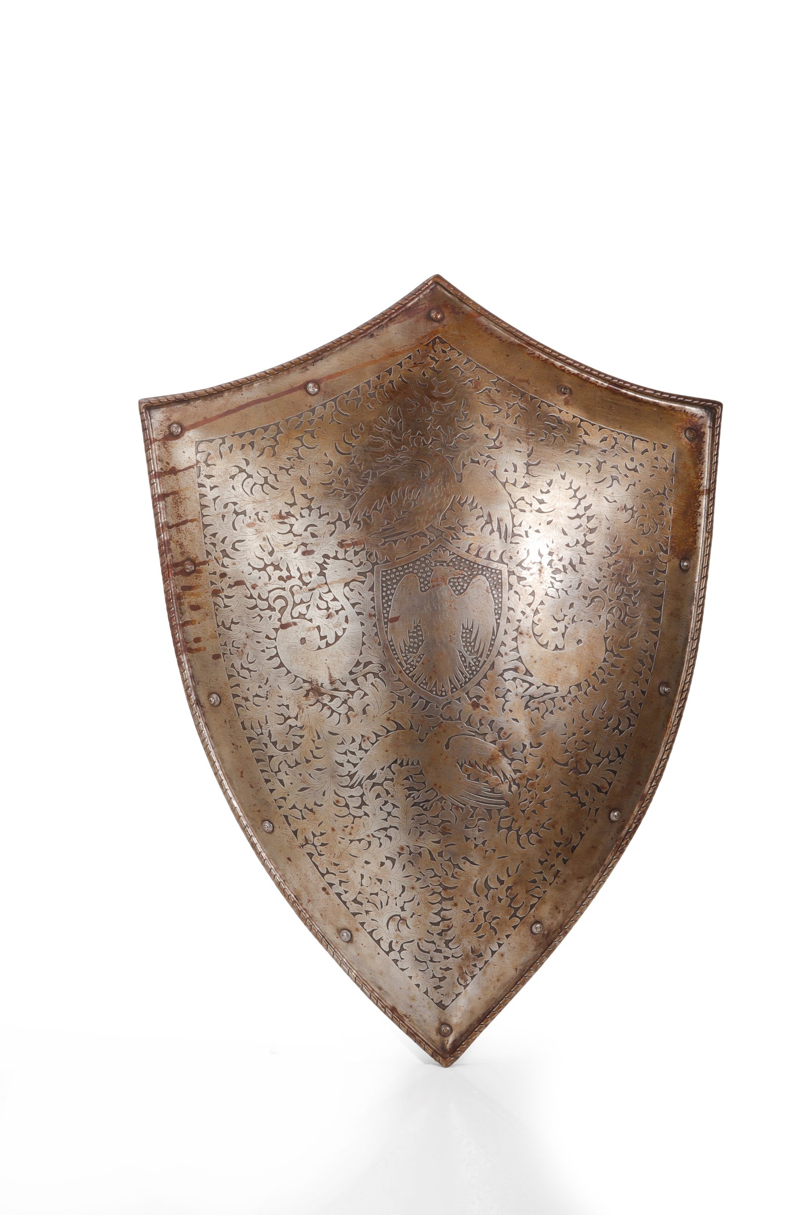 Victorian Etched Steel Shield, 19th C.: Europe, probably England or Continental Europe, 19th century. A Victorian decorative shield, with slightly convex body and rolled border. The face is finely etched with dense scrolling foliate