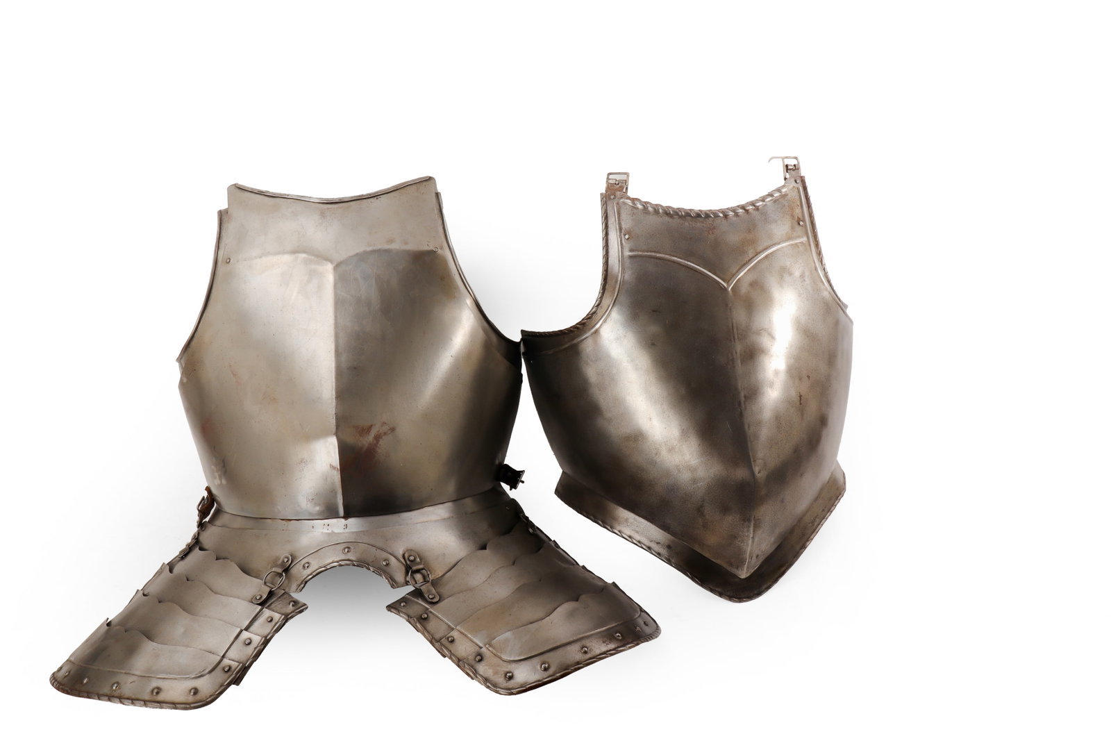 European Steel Armour Set, 16th C. Style: European steel armor made in the 16th century style but probably produced in the 20th century. The group comprising two shaped torso plates, one fitted with attached lower Fauld and articulated