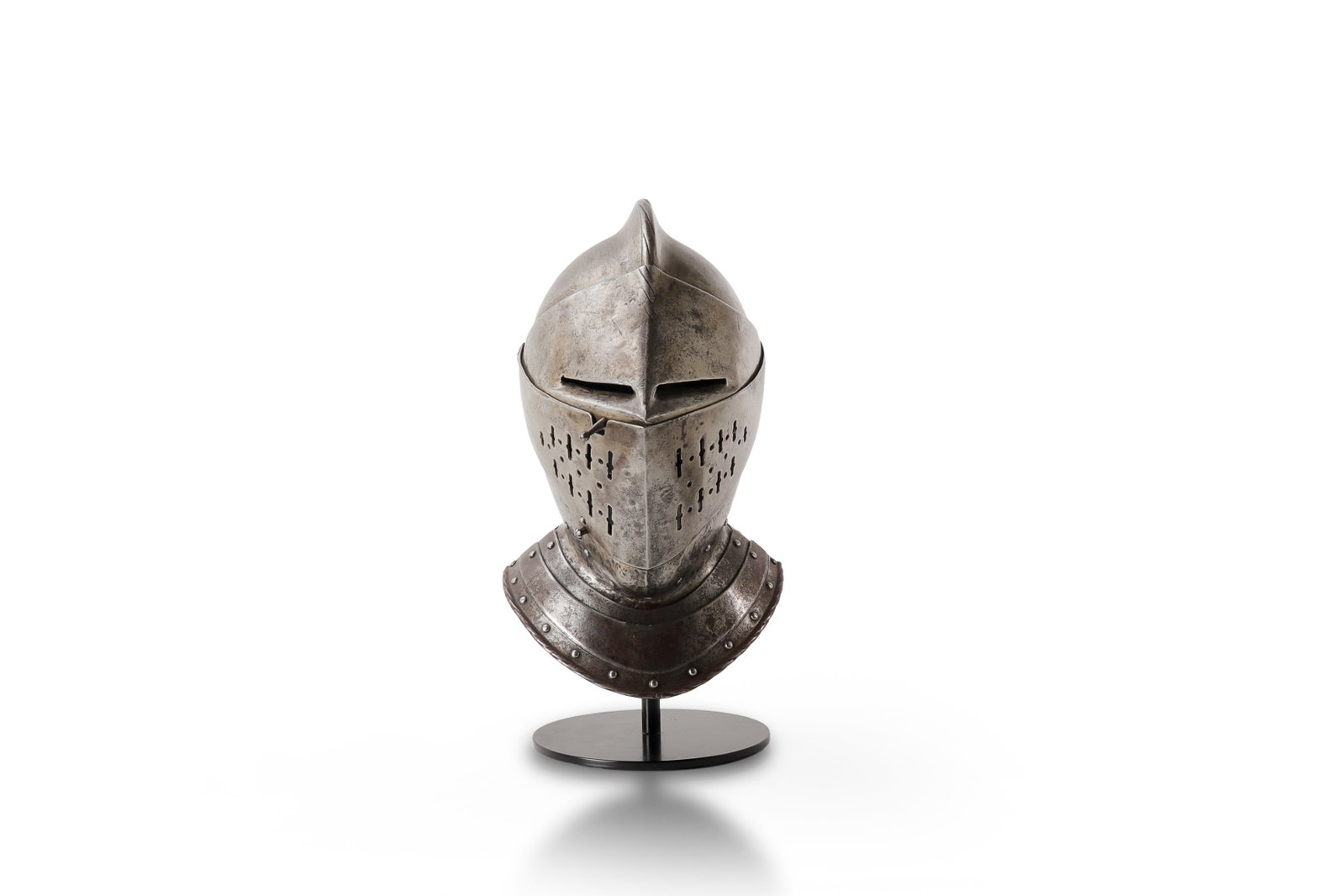 German Nuremberg Closed Helmet, Late 16th - Early 17th C.: German Nuremberg close helmet, late 16th to early 17th century, formed with a two-piece steel skull rising to a low roped comb. The visor is drawn forward to a pointed beak form, with elongated
