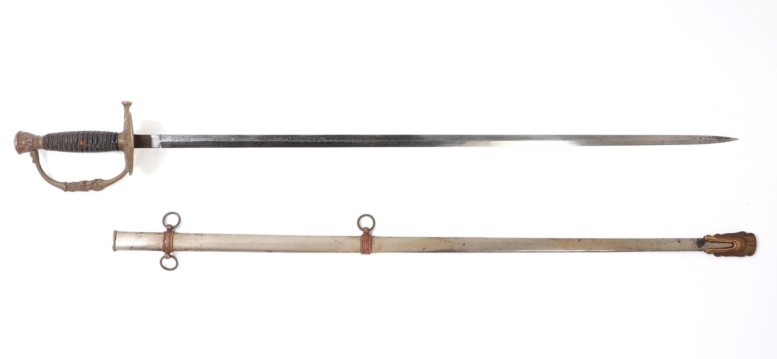 US Model 1860 Staff & Field Sword: US model 1860 Staff & Field sword with scabbard. Double sided blade etched with floral designs and US to one side and an eagle to the other. Grib bound with twisted brass wire. Pommel and guard